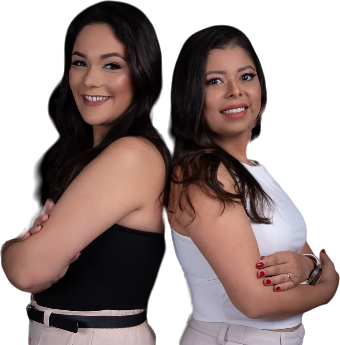 Dra. Gabrielle Lana e Dra. Andréia Bonfim, dentistas da Pode Sorrir, sorrindo de braços cruzados